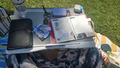 Outdoor journaling setup with a MARIS leather journal and a decorated planner, with private handwriting blurred